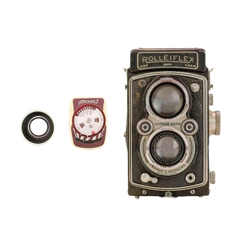 92 - A Rollieflex Compur-Rapid twin reflex camera. No 1063576, with fitted leather case.