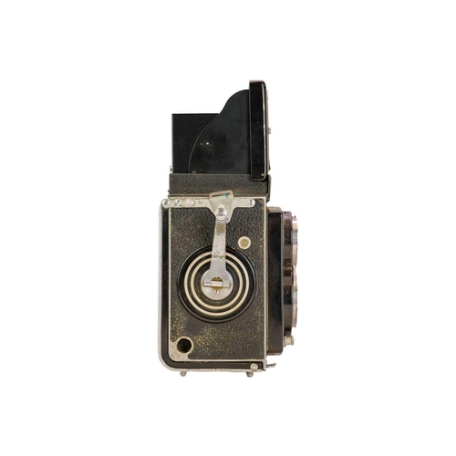 92 - A Rollieflex Compur-Rapid twin reflex camera. No 1063576, with fitted leather case.