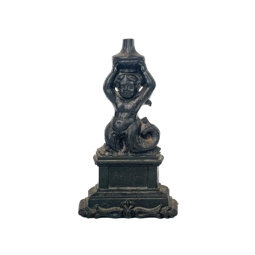 98 - A Coalbrookdale cast iron door stop. Cast as a merman, stamped marks, No1692 and 23, with a design r... 