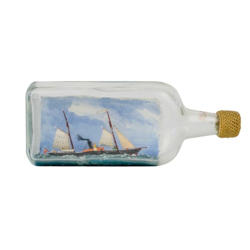 7 - Model ship in a bottle, circa 1890 Made by Mr K.G. Jones BEM, Penarth, Cornwall Amodel of the Isles ... 