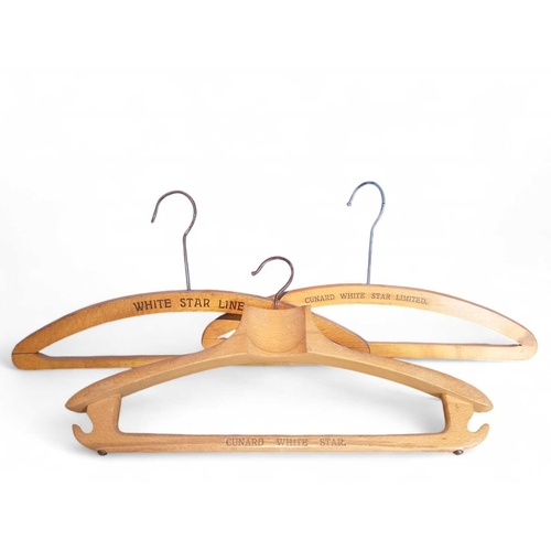 11 - Cunard White Star Line, three wooden clothes hangers. Each stamped (3).