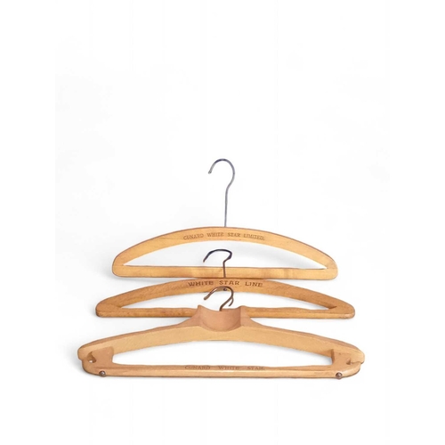 11 - Cunard White Star Line, three wooden clothes hangers. Each stamped (3).