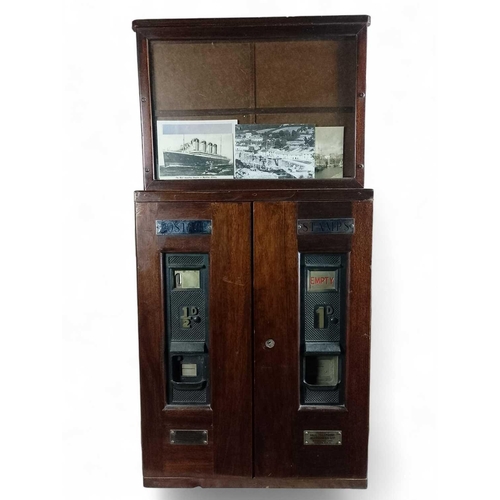 1123 - A Postage Vending Machine for 1d and 1/2d stamp rolls Constructed of mahogany and bronze with white ... 