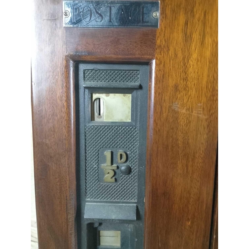 1123 - A Postage Vending Machine for 1d and 1/2d stamp rolls Constructed of mahogany and bronze with white ... 