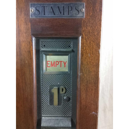 1123 - A Postage Vending Machine for 1d and 1/2d stamp rolls Constructed of mahogany and bronze with white ... 