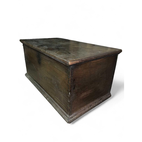 1143 - An 18th century boarded oak chest 14x62cm and 54cm high excluding the modern casters