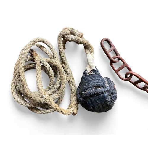 225 - A length of whittled wooden chain Together with two tarred monkey fist knots for throwing a line, a ... 