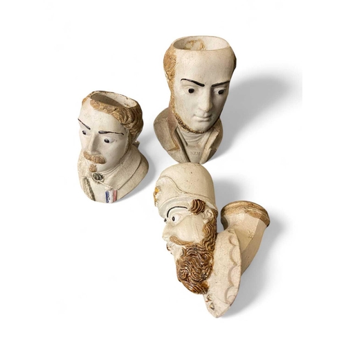 232 - Three novelty clay pipe heads Likely 19th century, depicting gentlemen's character heads.