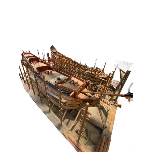 236 - Wooden model of an 17th century naval dockyard Highly detailed and depicting the construction of two... 