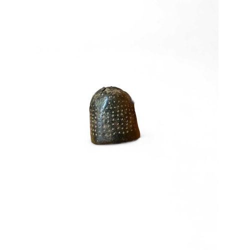 283 - Medieval Bronze A horse harness pendant 15mm wide, a bronze thimble, a key 3.5cm and a strap end and... 