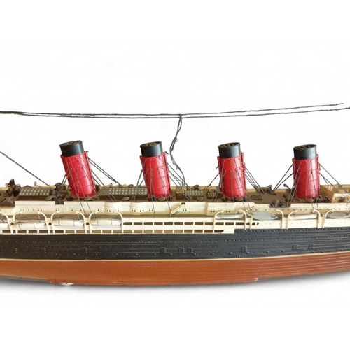 37 - RMS Lusitania A hand-built model of the ship Plastic construction, c1960's, 68cm in length.