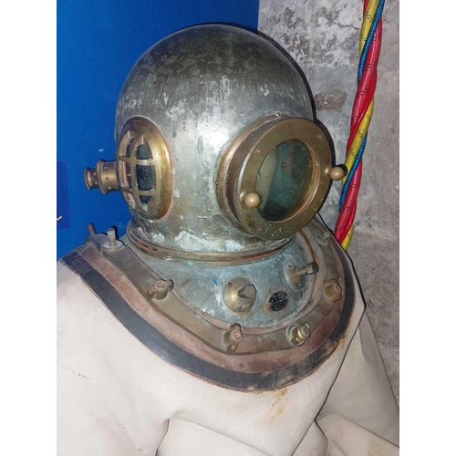 487 - An early deep sea diving suit, ‘Siebe Gorman’ style Together with a brass fully-enclosing helmet wit... 