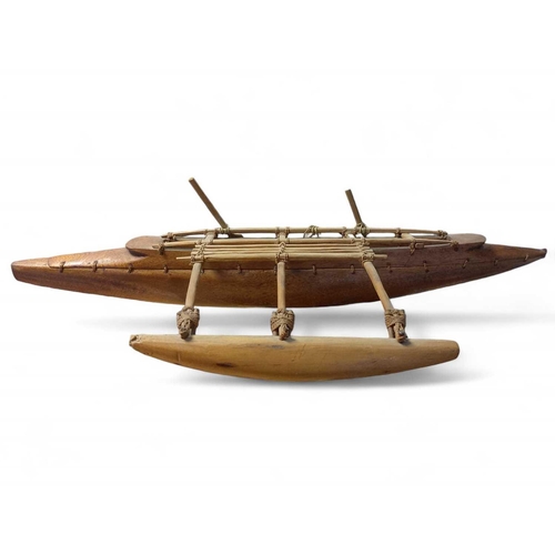 505 - An early 20th Century Model of a South Polynesian Outrigger Canoe Wooden canoe with ropework thread ... 