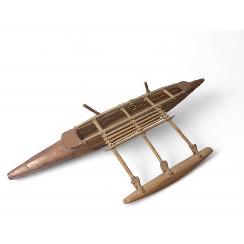 505 - An early 20th Century Model of a South Polynesian Outrigger Canoe Wooden canoe with ropework thread ... 