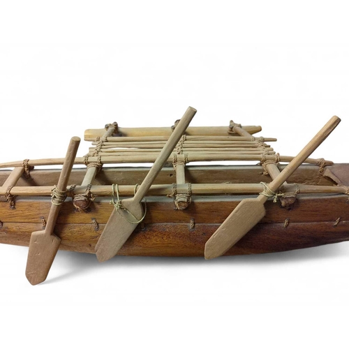 505 - An early 20th Century Model of a South Polynesian Outrigger Canoe Wooden canoe with ropework thread ... 