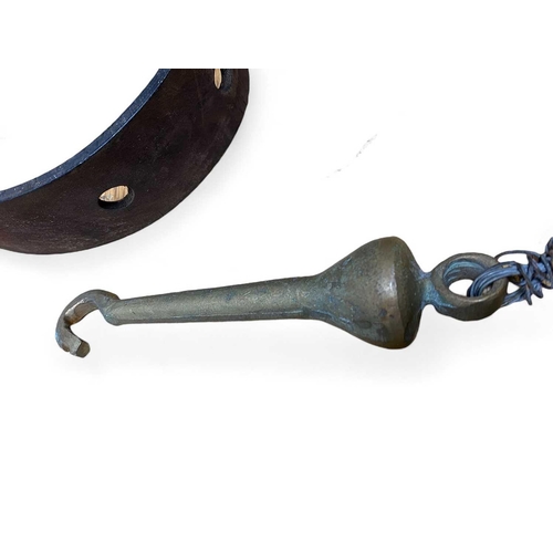 856 - A leather belt and a brass bell clapper The heavy brass clapper L17cm with ornate bell rope. The bel... 