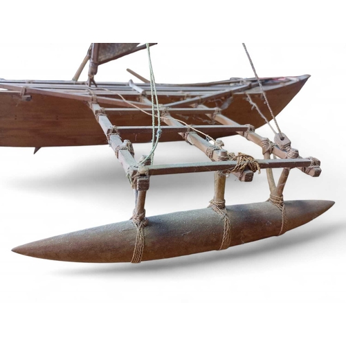 889 - A Scratch-Built Outrigger Canoe Made entirely from wood and organic material fittings, with two wood... 