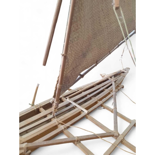 889 - A Scratch-Built Outrigger Canoe Made entirely from wood and organic material fittings, with two wood... 