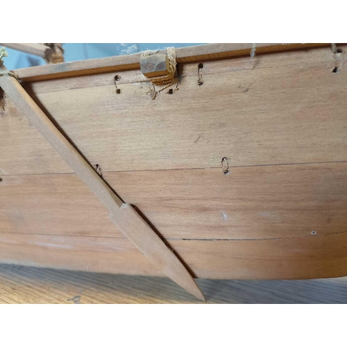 889 - A Scratch-Built Outrigger Canoe Made entirely from wood and organic material fittings, with two wood... 