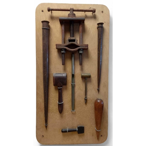 906 - A Sailmaker's Tool Display Mounted onto wooden board, 78cm x 40cm.