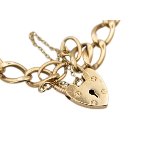 100 - A 9ct gold curb link bracelet with padlock clasp, applied with a smoky quartz pendant. Stamped 375, ... 