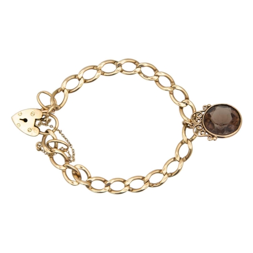 100 - A 9ct gold curb link bracelet with padlock clasp, applied with a smoky quartz pendant. Stamped 375, ... 