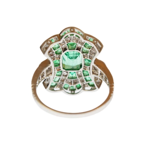 116 - A good Edwardian style emerald and diamond set dress ring, set in 850 platinum. The step and calibre... 