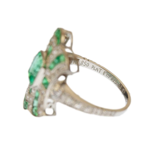 116 - A good Edwardian style emerald and diamond set dress ring, set in 850 platinum. The step and calibre... 