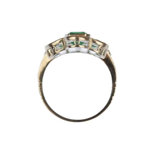 116 - A good Edwardian style emerald and diamond set dress ring, set in 850 platinum. The step and calibre... 