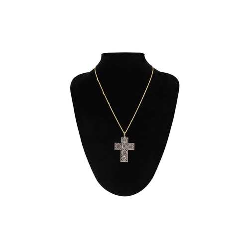 118 - An unusual cross pendant set with slice-cut diamonds and rose cut diamonds. Set in silver gilt, the ... 