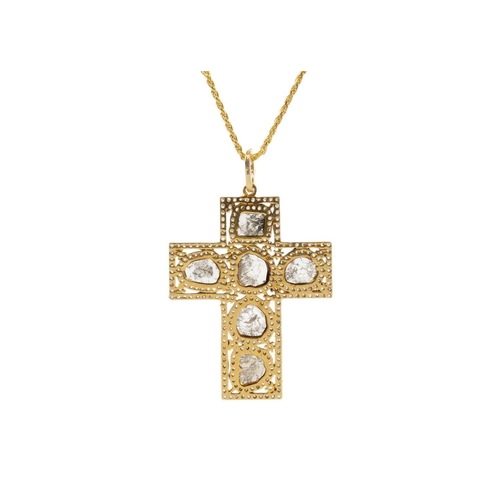 118 - An unusual cross pendant set with slice-cut diamonds and rose cut diamonds. Set in silver gilt, the ... 