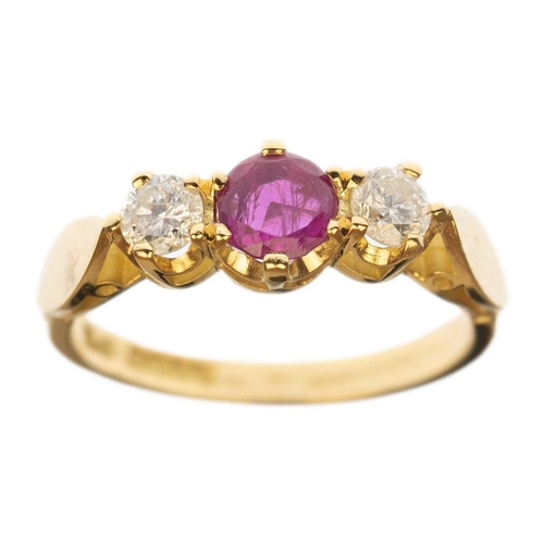 121 - An 18ct ruby and diamond three-stone ring. The round cut ruby of 0.58ct estimated weight, the round ... 