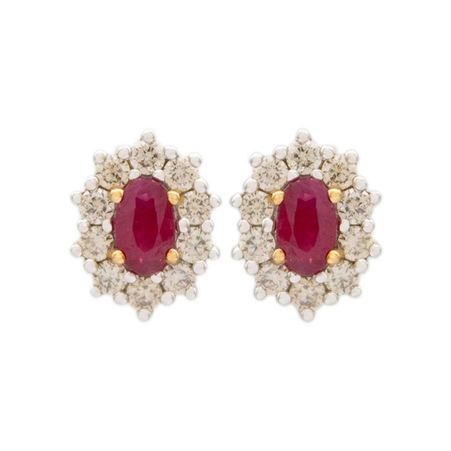 123 - A pair of 9ct oval ruby and diamond cluster stud earrings. The rubies of 0.60ct total estimated weig... 