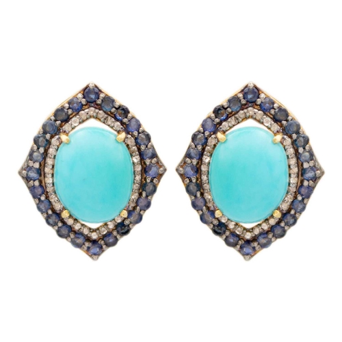 128 - A pair of vintage style earrings set with a large oval turquoise, sapphires and diamonds. Set in sil... 