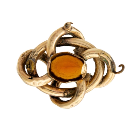 155 - A Victorian high-purity gold (tests 14ct) large citrine set knot brooch. Comprising hollow loops, th... 