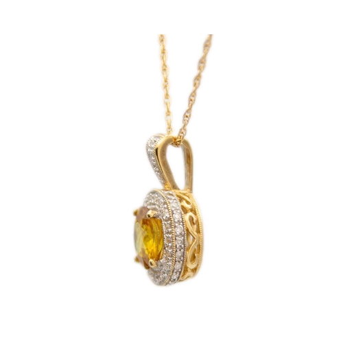 16 - A 9ct yellow sphene (titanite) and diamond cluster pendant on a 9ct necklace. The sphene of 1.50ct e... 