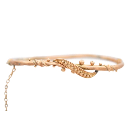 164 - A selection of 9ct rose gold jewels. Including a hollow bangle, a padlock clasp, pair of cufflinks a... 