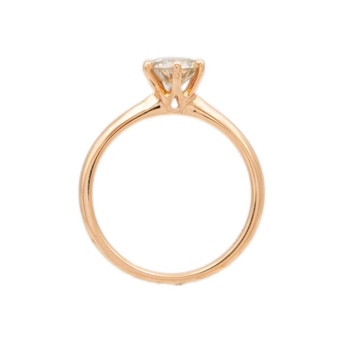 188 - An 18ct rose gold 0.81ct diamond solitaire ring. The round cut brilliant diamond assessed as M estim... 