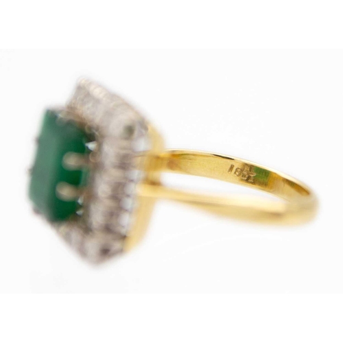 190 - An attractive emerald and diamond 18ct set cluster ring. The large square cut emerald of 9 x 9.1 x 3... 