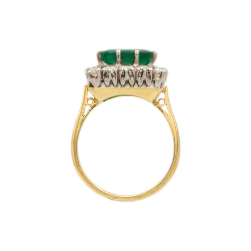 190 - An attractive emerald and diamond 18ct set cluster ring. The large square cut emerald of 9 x 9.1 x 3... 