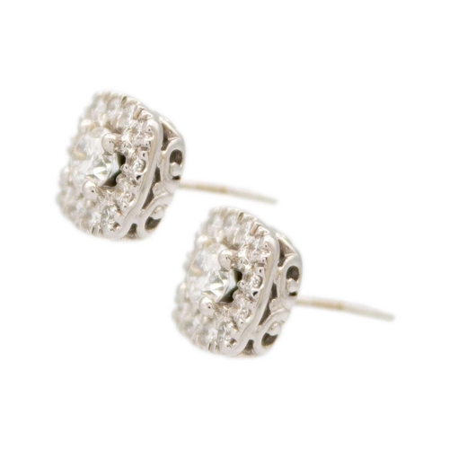 193 - A pair of 14ct white gold diamond set rounded square cluster stud earrings. The diamonds of 1.00ct t... 