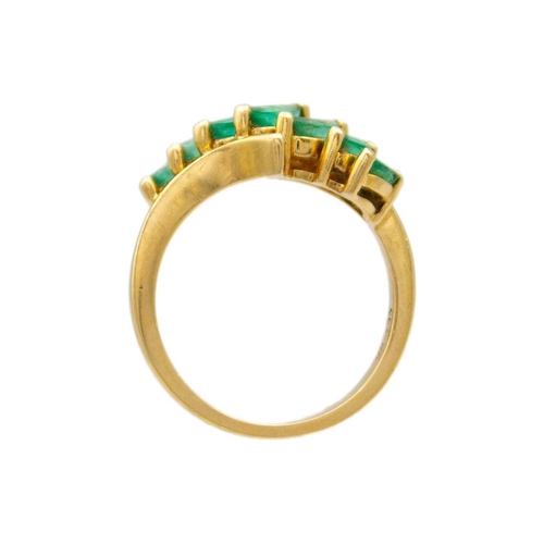 194 - A 14k gold seven claw set marquise cut emerald ring The ring comes in original 'Colombian Emeralds I... 