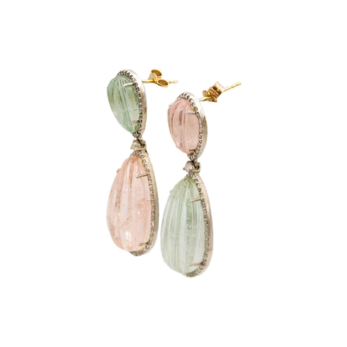 198 - An unusual pair of large drop earrings set with carved aquamarines and morganites. The white metal s... 