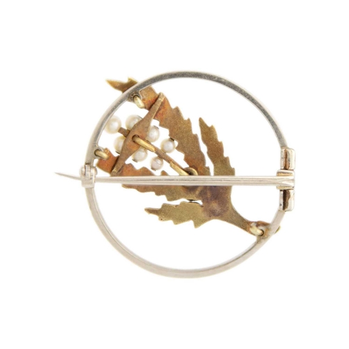 202 - A yellow and white gold seed pearl set sprig and berry design brooch. Diameter 26mm, 4.8g.