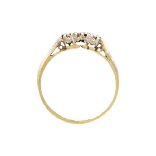 217 - An 18ct yellow gold three stone diamond ring The diamonds set in platinum, the principal stone of 0.... 