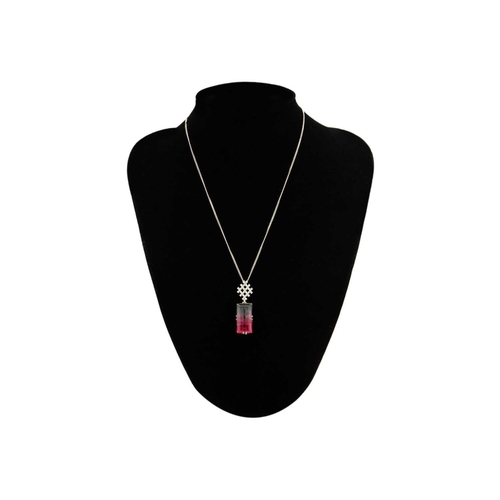 22 - A rare bi-colour tourmaline and diamond pendant, set in 18ct white gold. The tourmaline measuring 22... 