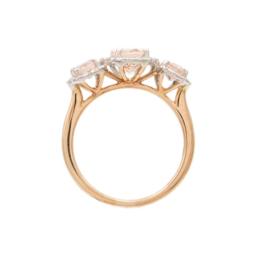 226 - An attractive 9ct rose gold oval morganite and diamond set dress ring. The three oval morganites of ... 