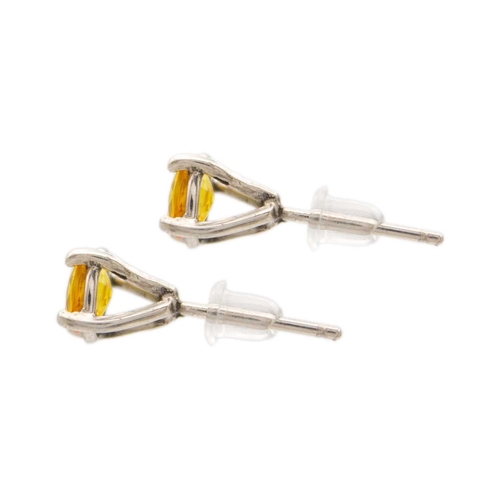 229 - A pair of yellow sapphire ear studs, 1.8ct total, set in .999 platinum. By James Suddaby. Birmingham... 