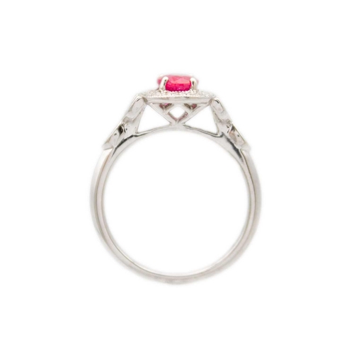 230 - A 1.03ct ruby and diamond set halo ring, set in 18ct white gold. By River Mounts. The oval cut ruby ... 