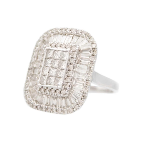 231 - An impressive large 9ct white gold diamond set cocktail ring. The rounded square head set with bague... 